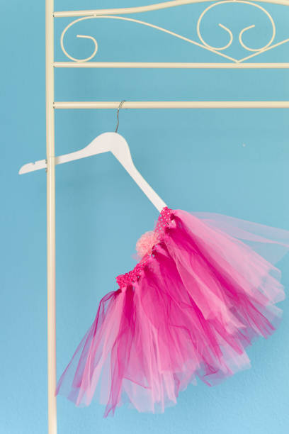 istock Pink tutu hanging up on clothes rail 1243251331