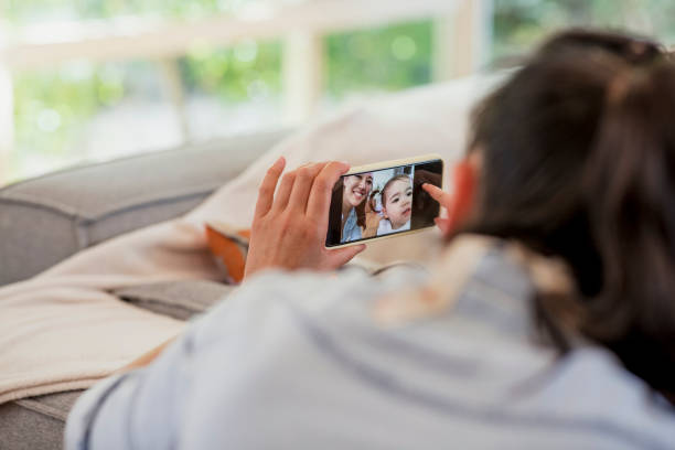 istock Mother and Daughter Taking a Selfie 1243256866