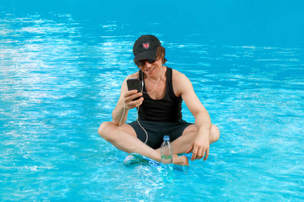 istock Guy Listening to Music in Water 1243282062
