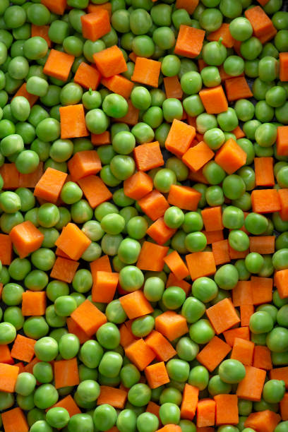 Organic Fresh Green Pea and Carrot Salad Background stock photo