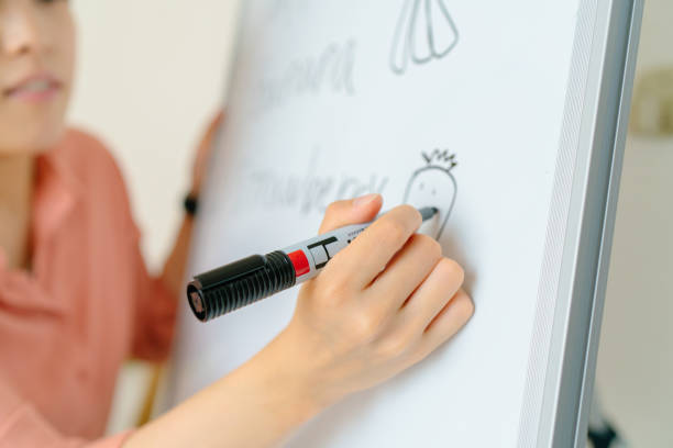 istock Teacher teaching online via laptop at home 1243318706