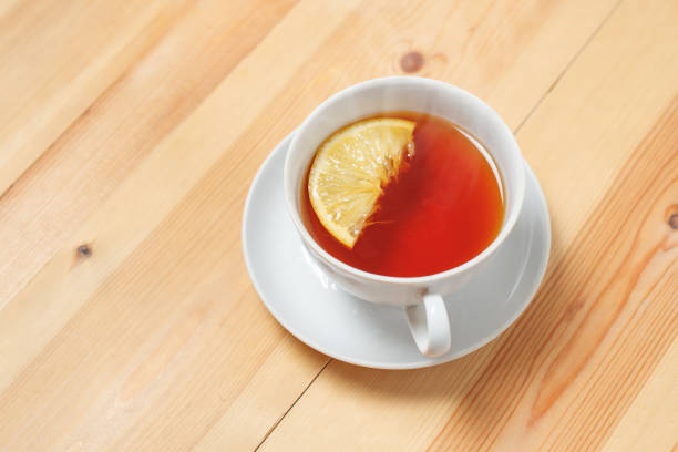 istock Cup of tea with lemon on the wooden table 1243318708