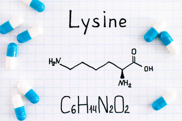 Chemical formula of Lysine with some pills. Chemical formula of Lysine with some pills. Close-up. lysine stock pictures, royalty-free photos & images