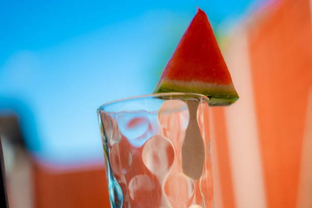 Icy watermelon slice shaped of a triangle on a glass. Iced fruits are a good option while relaxing at the backyard especially on bank holidays