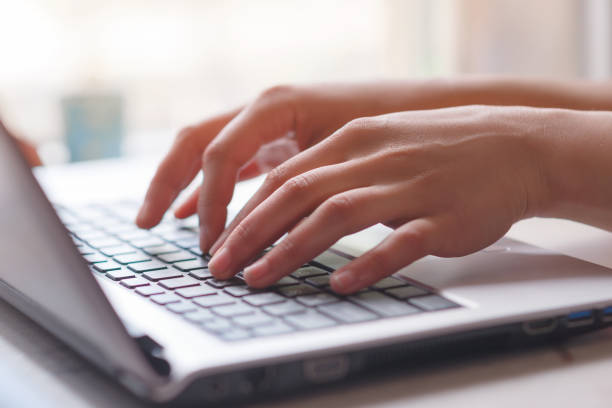 istock Woman working at home office hand on keyboard close up 1243363655