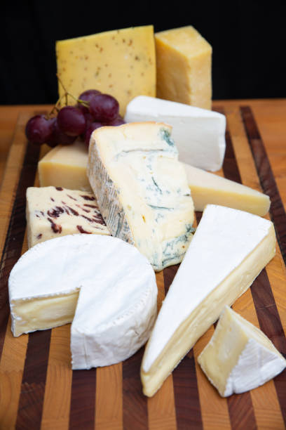 istock Different cheeses laying on wooden board 1243364185