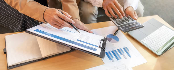 istock Business team brainstorming and discussing with financial data and report graph. Teamwork meeting working concept. 1243370235