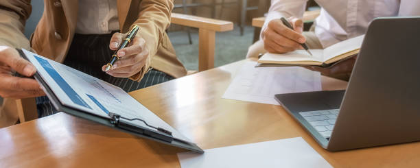 istock Business team brainstorming and discussing with financial data and report graph. Teamwork meeting working concept. 1243370253