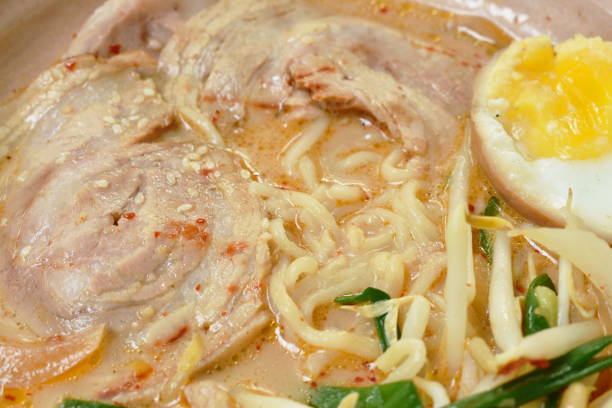 miso ramen or Japanese yellow noodles topping slice braised pork in soybean soup