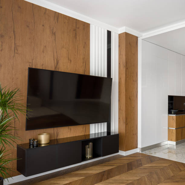 istock Room with big tv on wooden wall 1243376184
