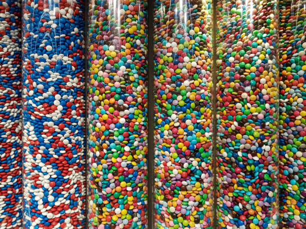 istock Colourful sweets and candy in glass tube display. 1243376200