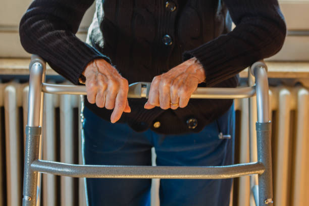 the hands of an elderly on a walker an old woman uses a walker because she has a mobility problems aids walk stock pictures, royalty-free photos & images