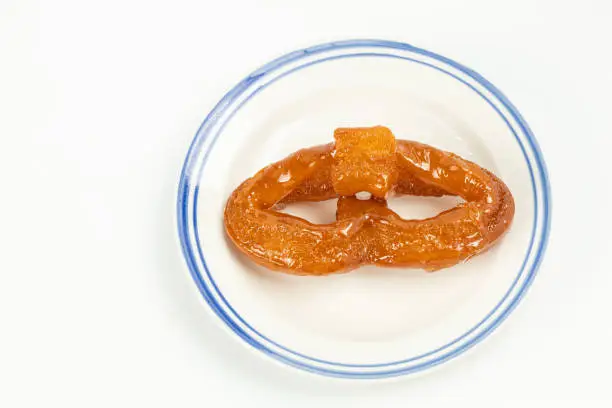 Old Beijing Halal Snack Ear-shaped twists(Tang erduo) with Sugar on White Background