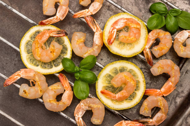 istock Grilled tiger shrimps on lemon. 1243387979