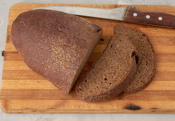 istock sliced oval rye bread bread on a wooden board 1243398541