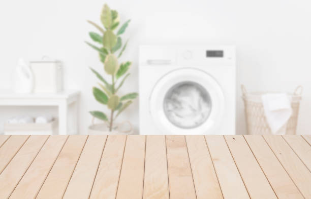 istock Wooden planks table template in laundry room for product display 1243398545