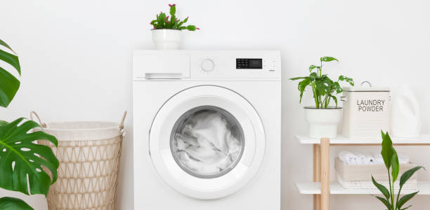 istock Close-up of rustic laundry room interior with washing machine 1243399063