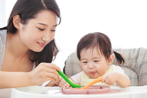 istock Mother to feed the baby 1243399610