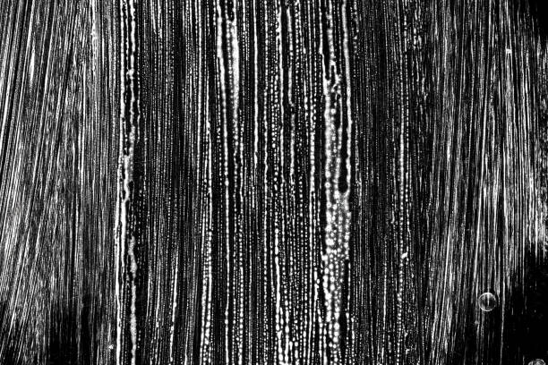 istock Foam grunge. White abstract bubble shampoo texture on black. water suds. Clean liquid bath soap background. House cleaning concept. 1243409225