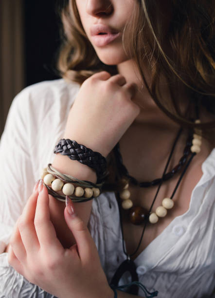 istock A woman with boho accessories. Bracelet, beads on the model close-up 1243415376