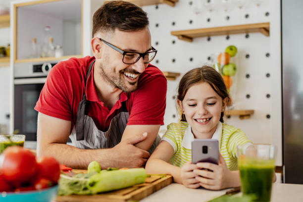 istock Father and his little daughter are in kitchen 1243421362
