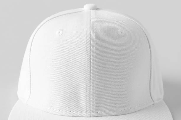 istock White snapback cap mockup on a grey background, closeup. 1243425209
