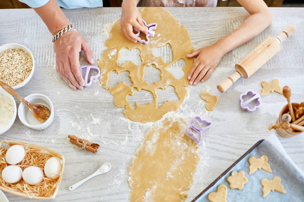 istock Father and daughter make cookies by mold 1243431131