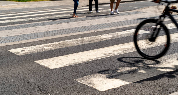 istock Pedestrian and cyclists using a zebra crossing to cross the road 1243432279
