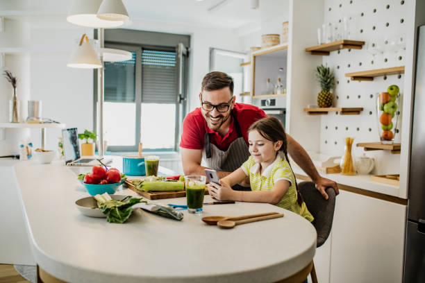 istock Father and his little daughter are in kitchen 1243437884
