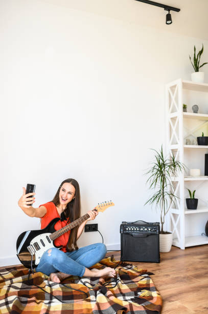 istock Woman makes selfie with an electric guitar 1243442598