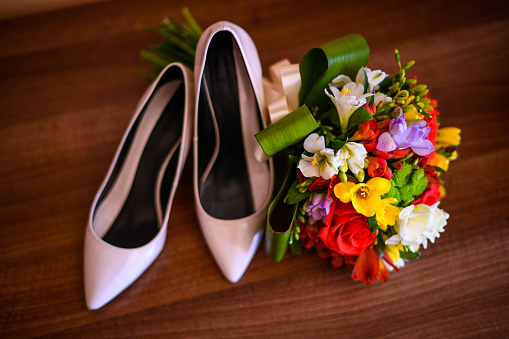 Bride's wedding bouquet and shoes