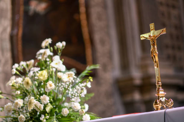 Golden cross standing in church