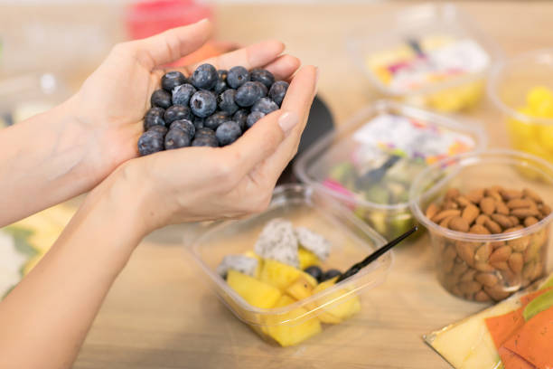istock Handful of fresh organic blueberries 1243460499