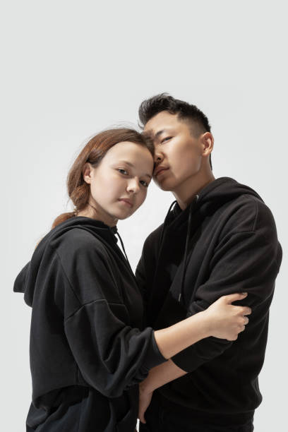 istock Trendy fashionable couple isolated on white studio background 1243462779