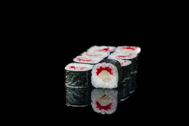 istock Sushi Roll On A Black Background reflection . Japanese food. Close Up. 1243463353