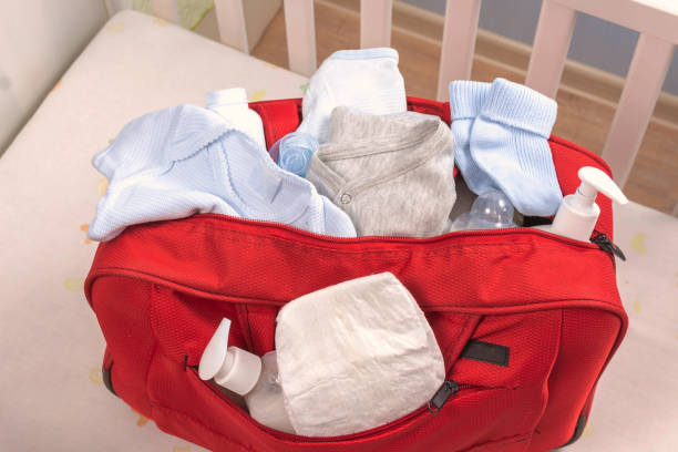 istock Big red diaper bag for maternity hospital. 1243471706