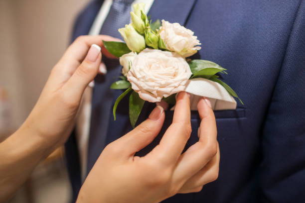 istock flower boutonniere in a jacket with hadns 1243480086