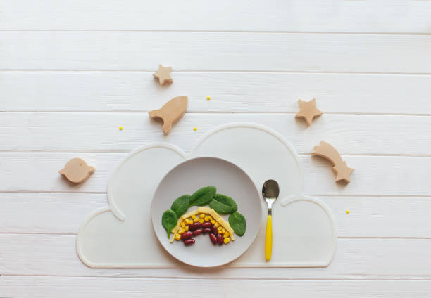 istock Rainbow from beans, corn, cheese and spinach on white wooden background 1243480436