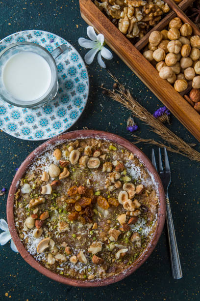 istock Top view of Egyptian bread pudding on table with cup of milk 1243481978