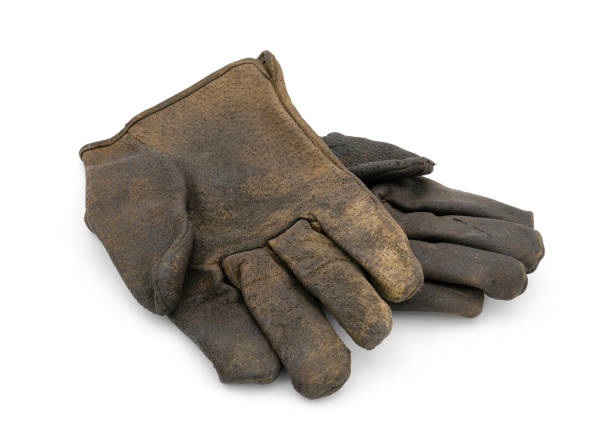 istock Old dirty leather gloves isolated on white background with clipping path 1243485931