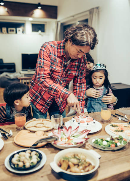 istock Father Cutting The Birthday Cake 1243492671
