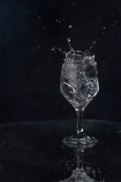 istock A splash with water and ice on a black background 1243495033