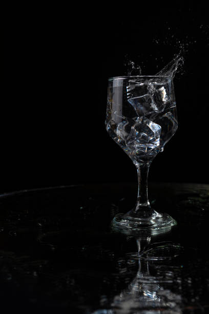 istock A splash with water and ice on a black background 1243495560