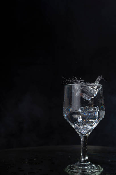 istock A splash with water and ice on a black background 1243495596
