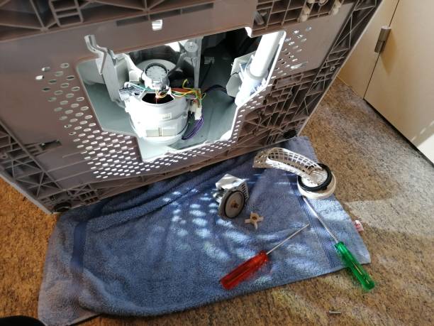 Washing machine drain pump replacement stock photo