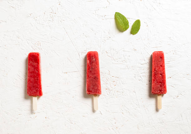istock Delicious strawberry popsicles on white background 1243518887
