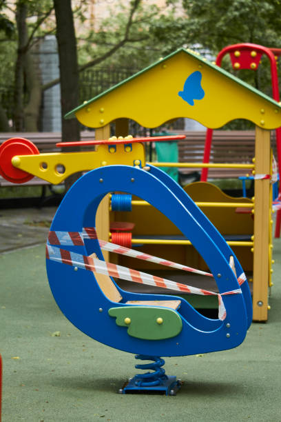istock An empty playground without children with striped red and white warning tape, limitations quarantined for Covid19 coronavirus 1243554066
