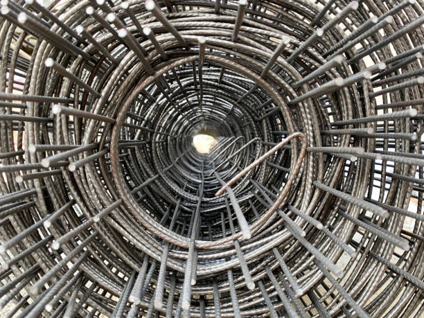 istock Middle hole of steel bar rolled in circle shape for home construction 1243562877