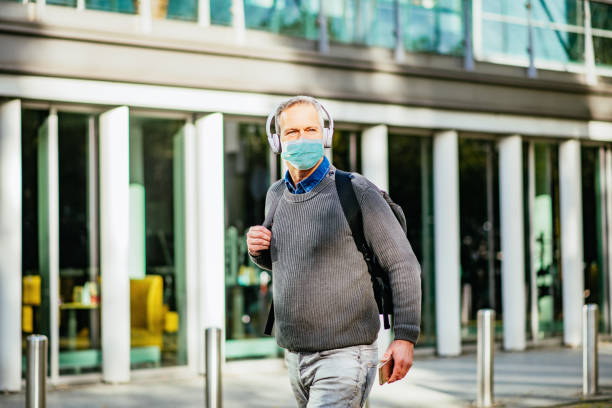 istock Essential worker with face mask going to work during covid-19 lockdown in Western Europe 1243564527