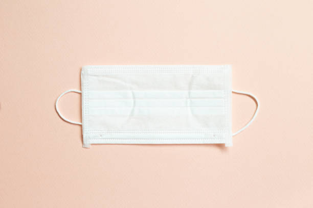 istock Medical mask on pink background. Simple, minimal 1243566098